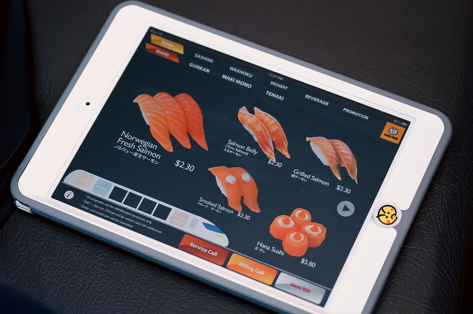 Genki Sushi touchscreen ordering tablet displaying salmon sushi options and menu categories.
