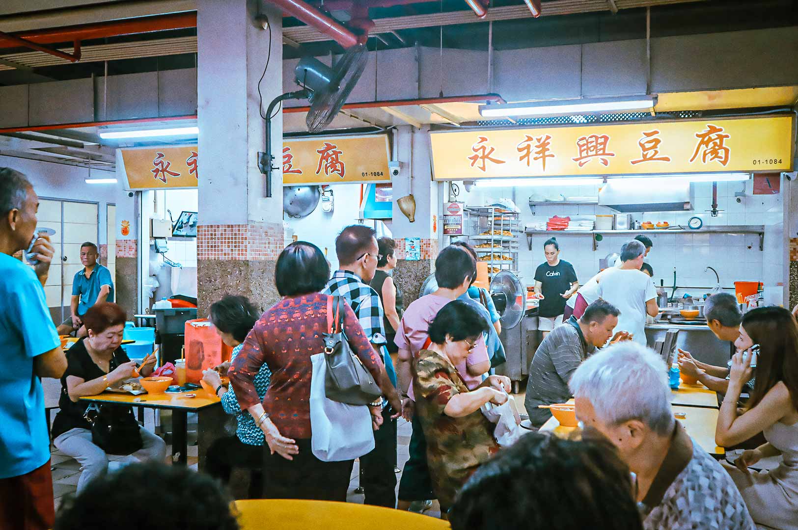 Queue of customers at a hawker stall Yong Xiang Xing Dou Fu.
