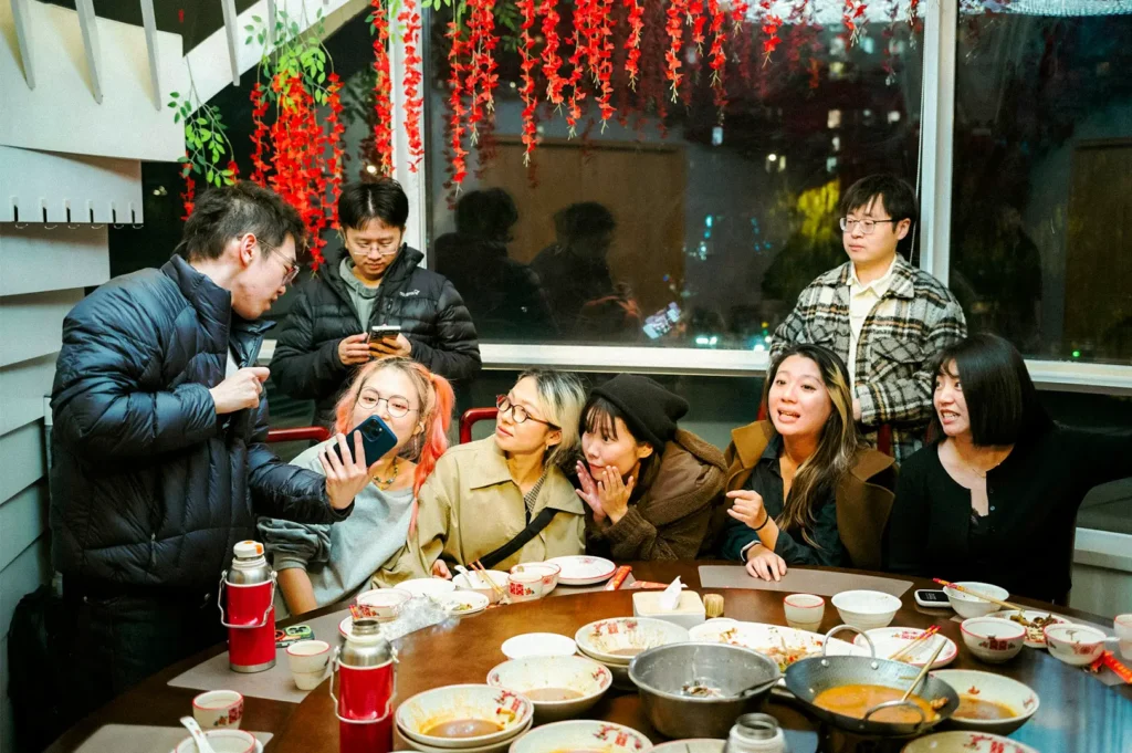 A group of people in an intimate moment while dining together.